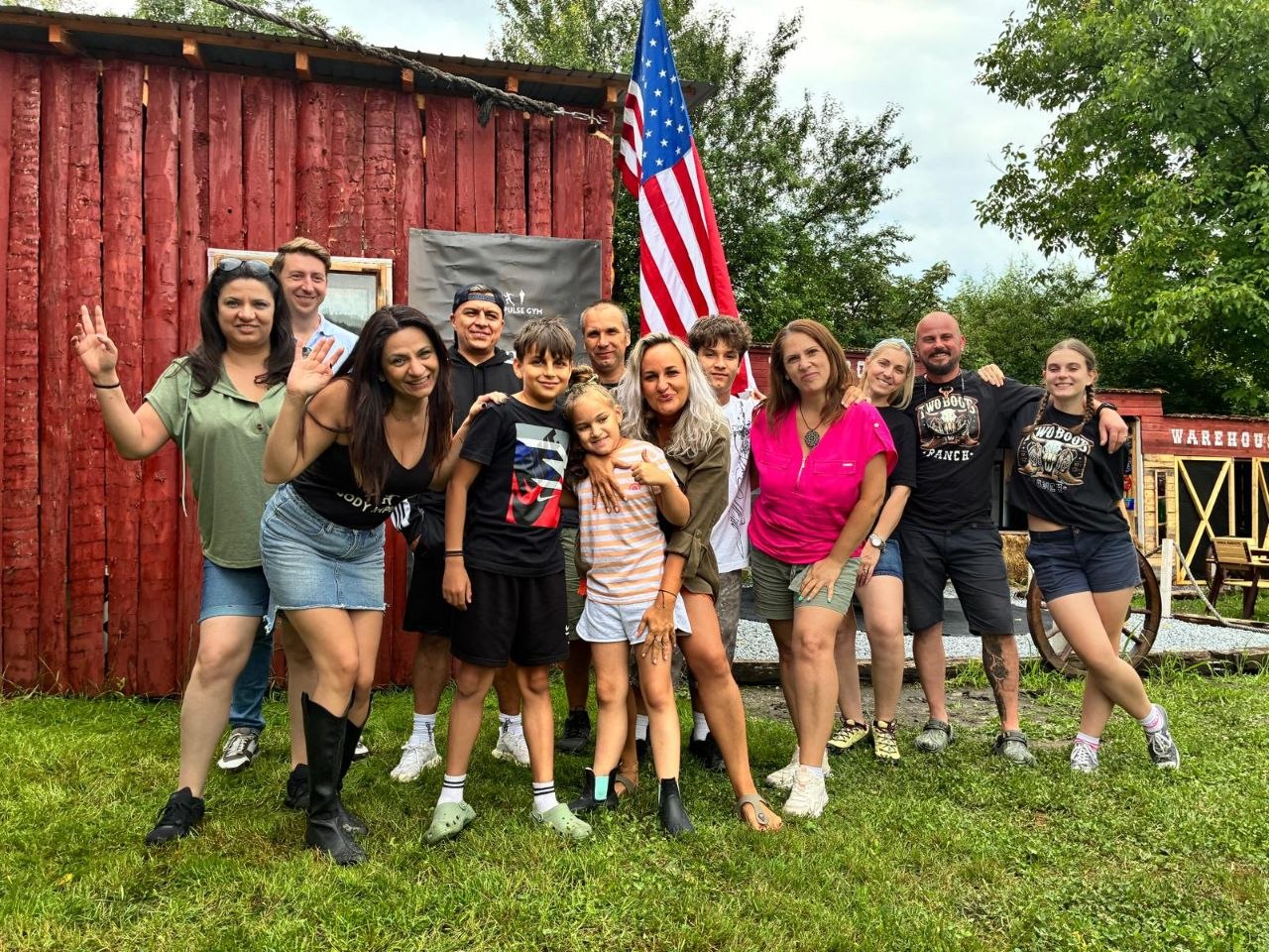 Body Impulse guests together outside the red ranch building