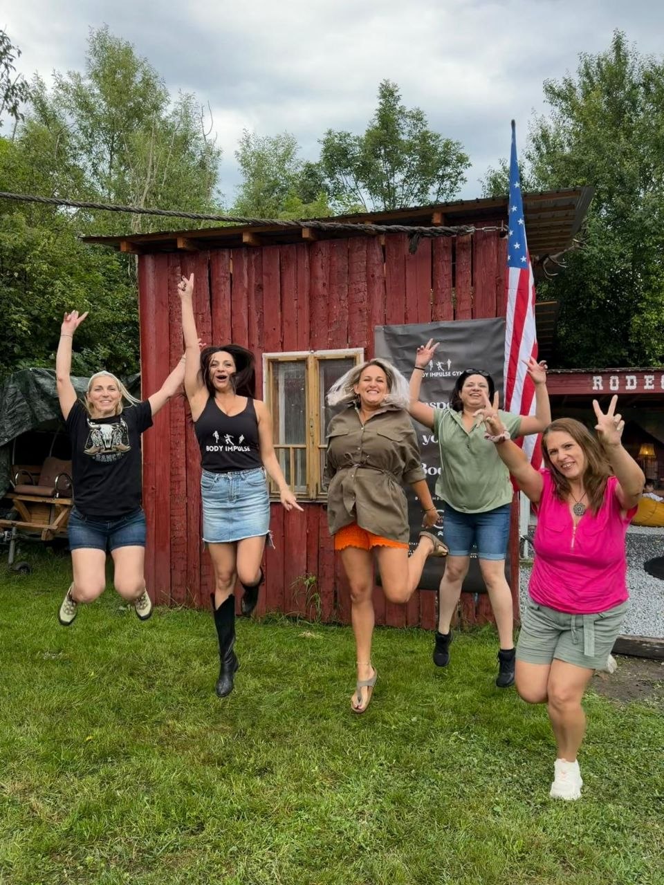 Body Impulse guests jumping and celebrating at Two Boots Ranch