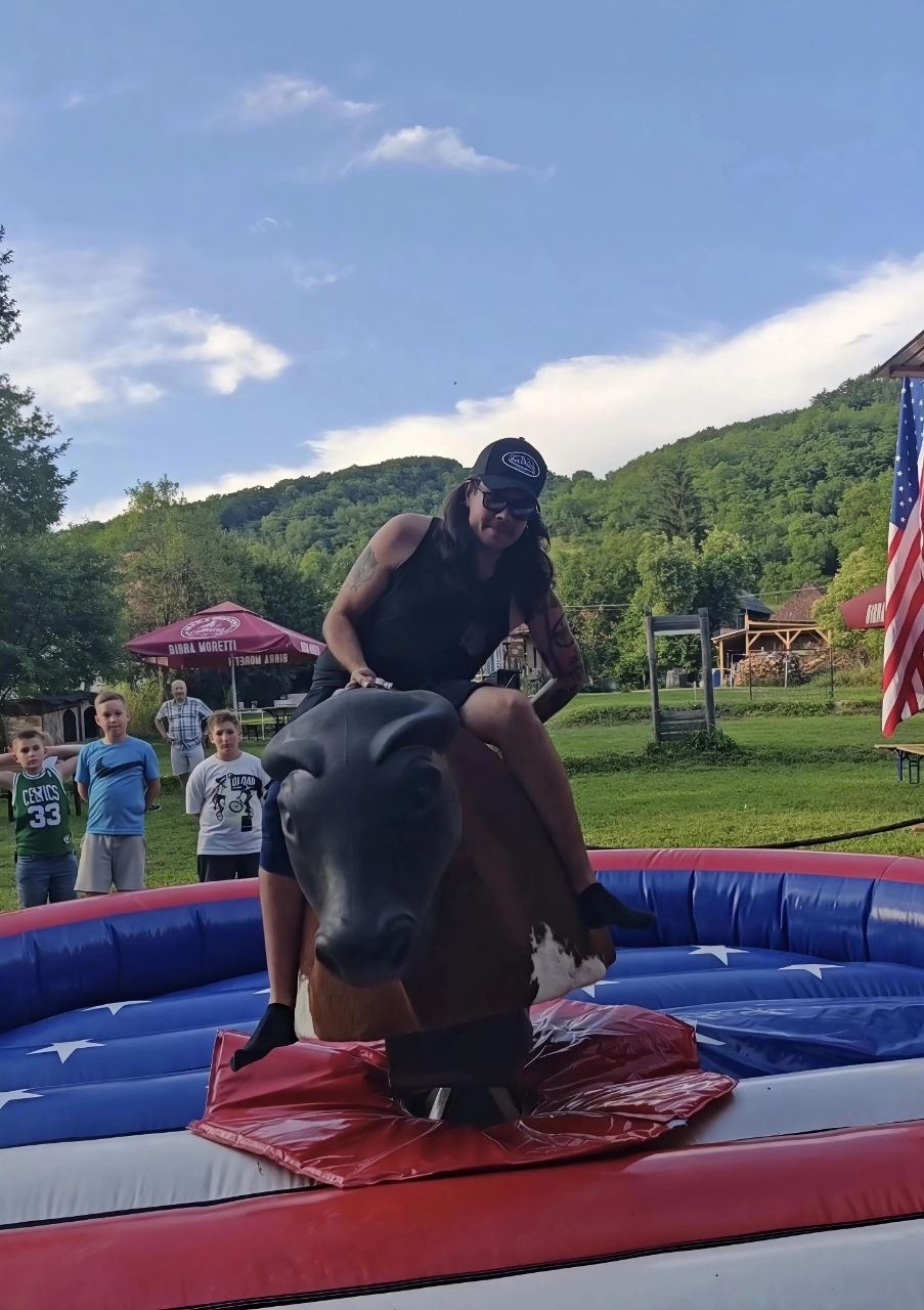 Guest riding the mechanical bull at Two Boots Ranch